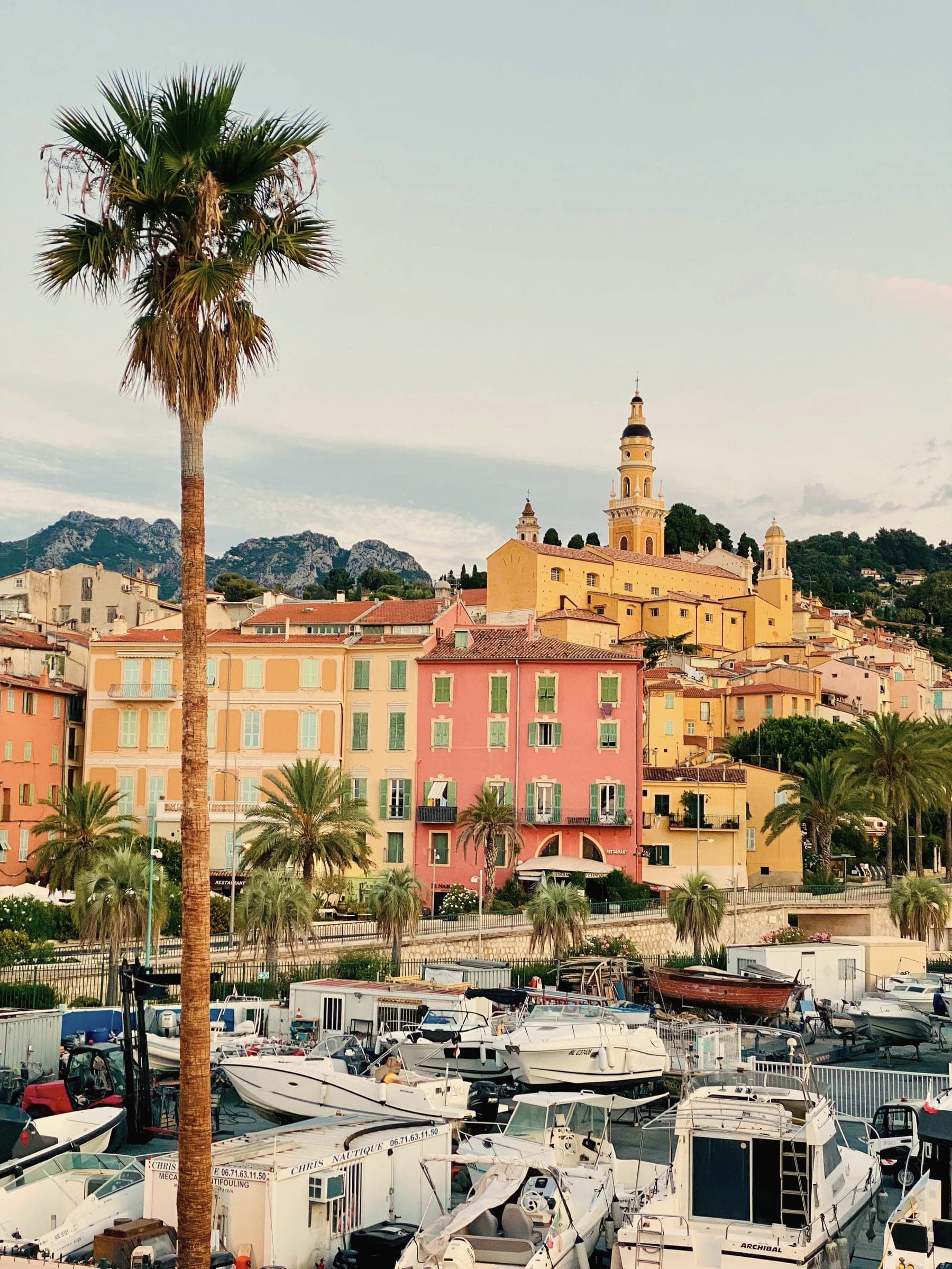 Menton harbour and basilica in warm evening light
