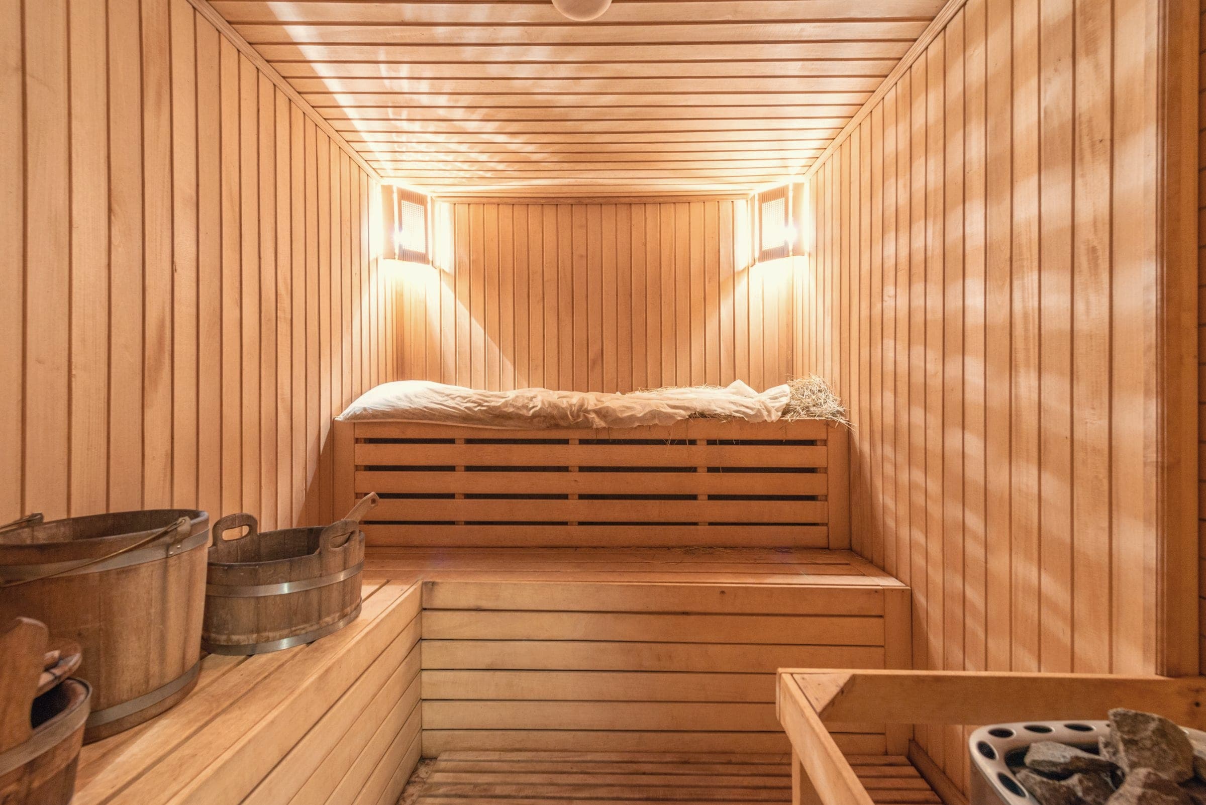 A wooden sauna with wooden buckets