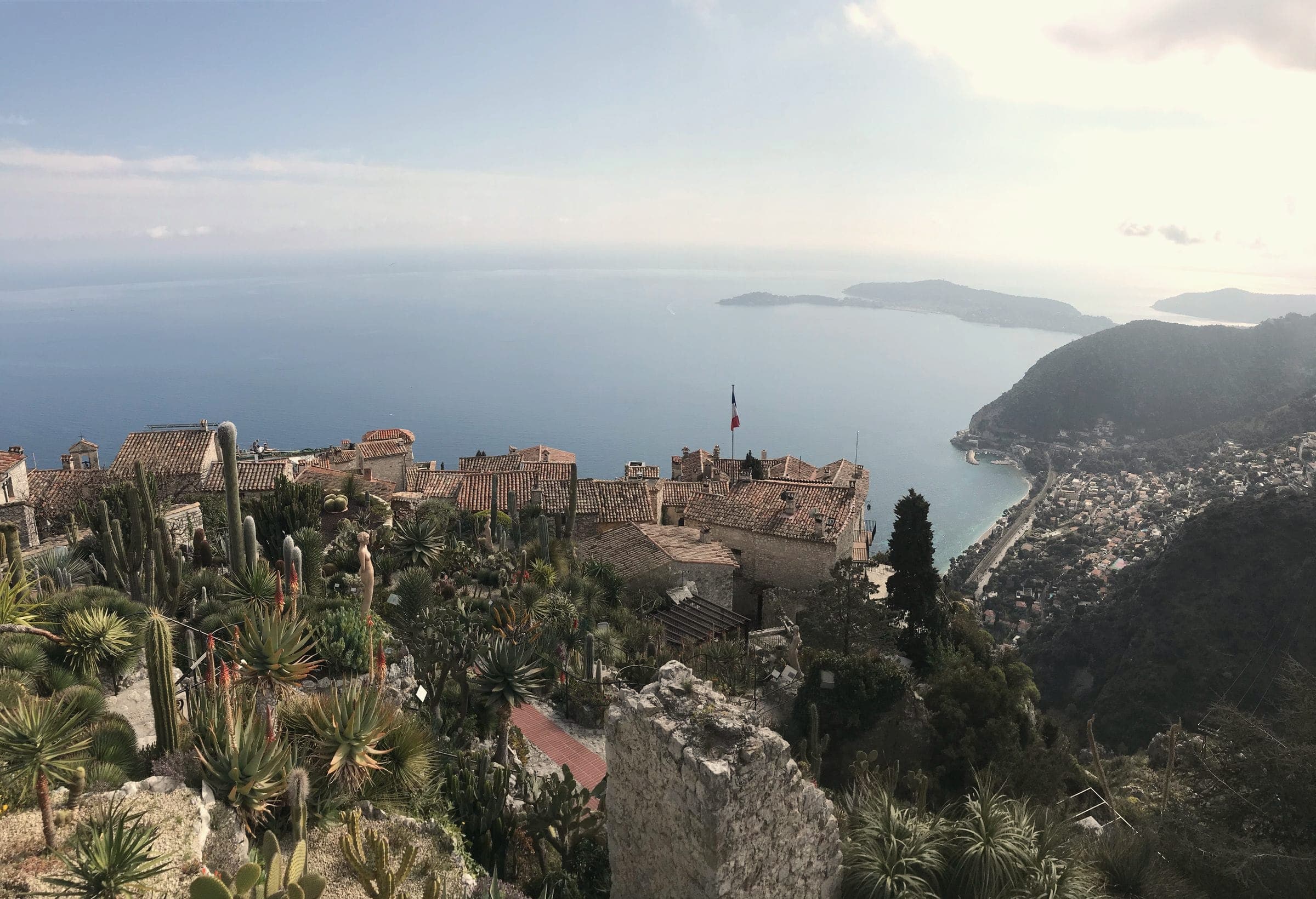 Èze and the Mediterranean seen from the exotic garden, with cacti in the foreground